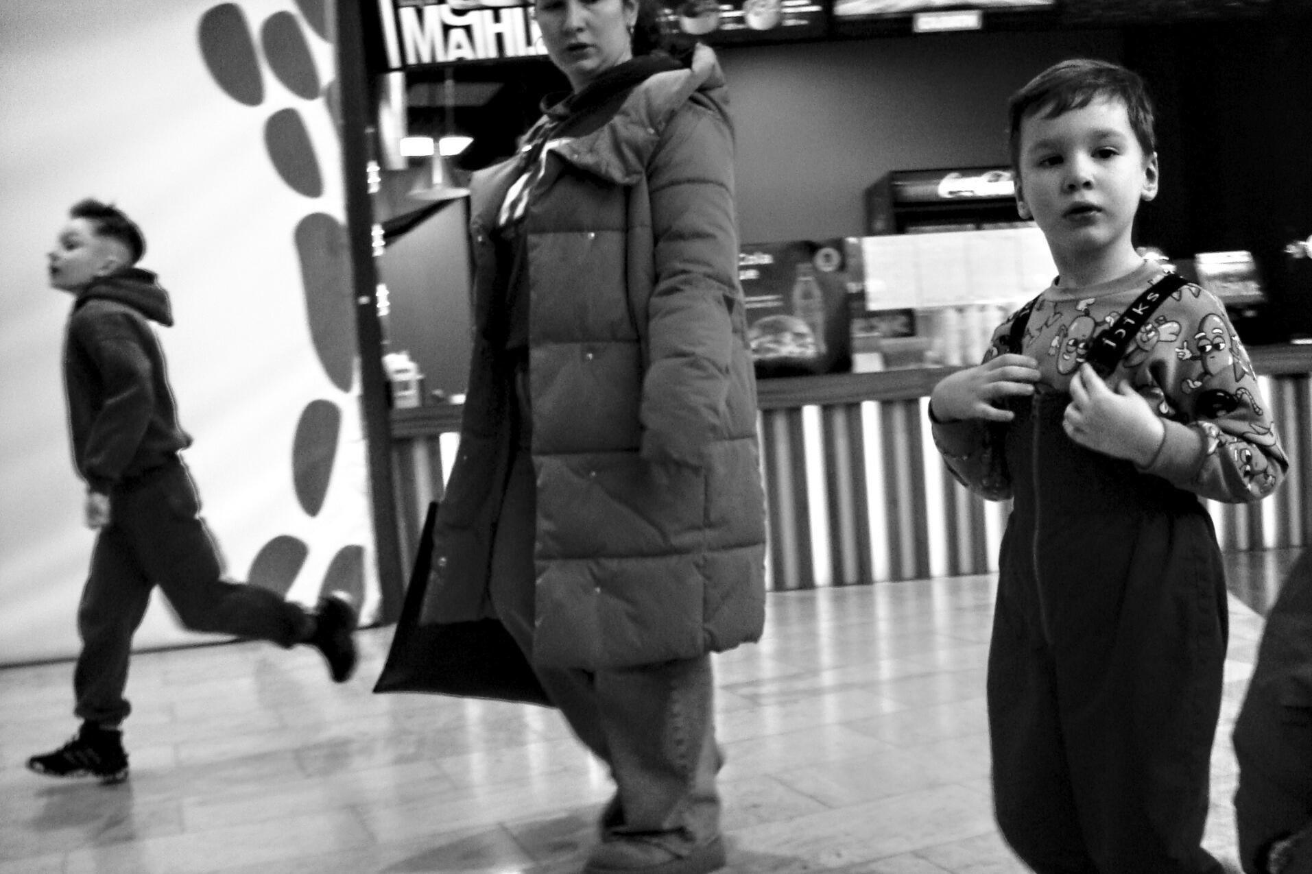 Like mother like son. Another bit of street type photography from a mall in Kyiv, Ukraine. Shot in February 2025 on Sony DSC-T100.
